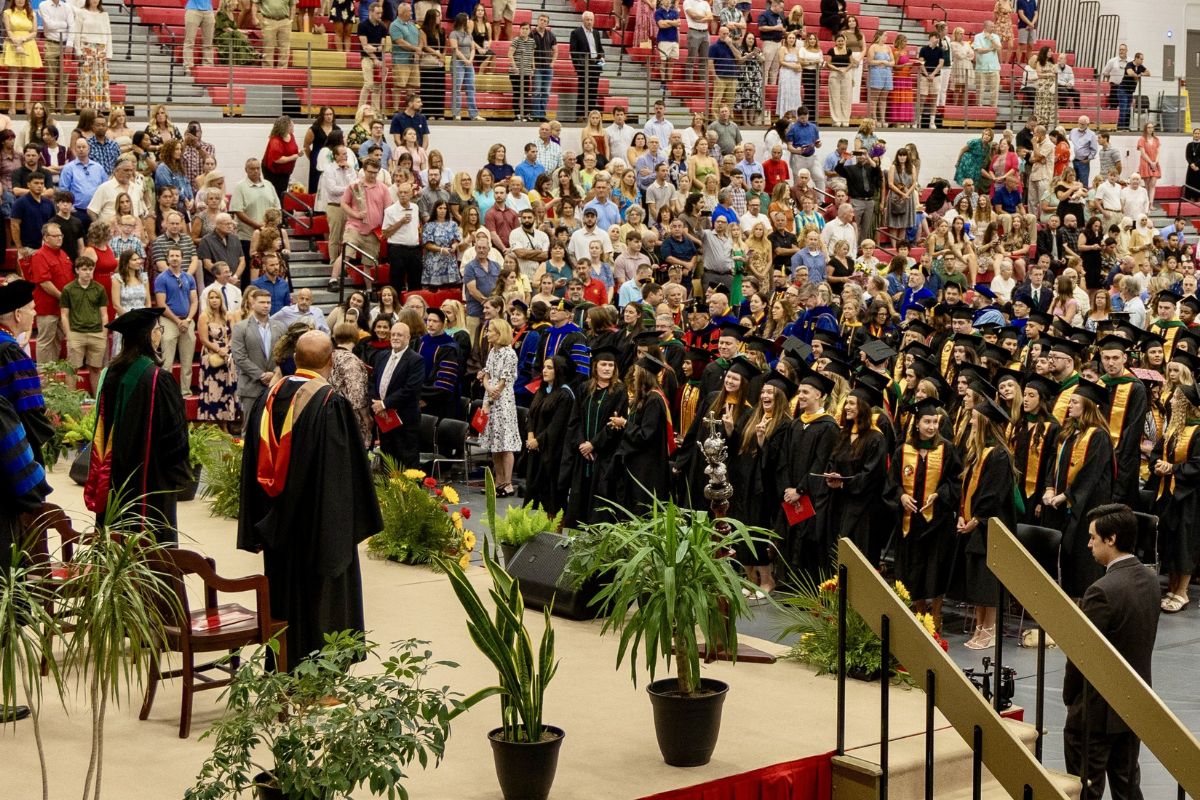 Wide shot of graduates and guests during ceremony