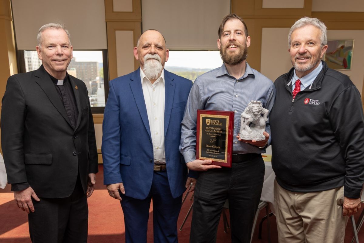 (from left to right) Rev. Thomas P. Looney, president of King’s College, Paul Moran, chief information officer, Kevin Chlipala, outstanding adult learner 2026, and Louis Palmeri, academic advisor for part-time students.