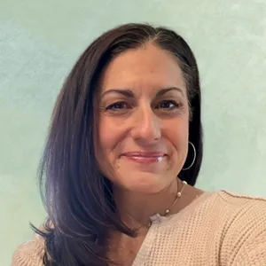 Portrait photo of Jessica in professional attire.
