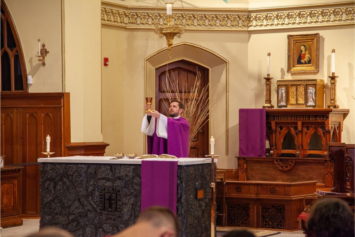 Fr. Brogan performing from 2024 Ash Wednesday Mass