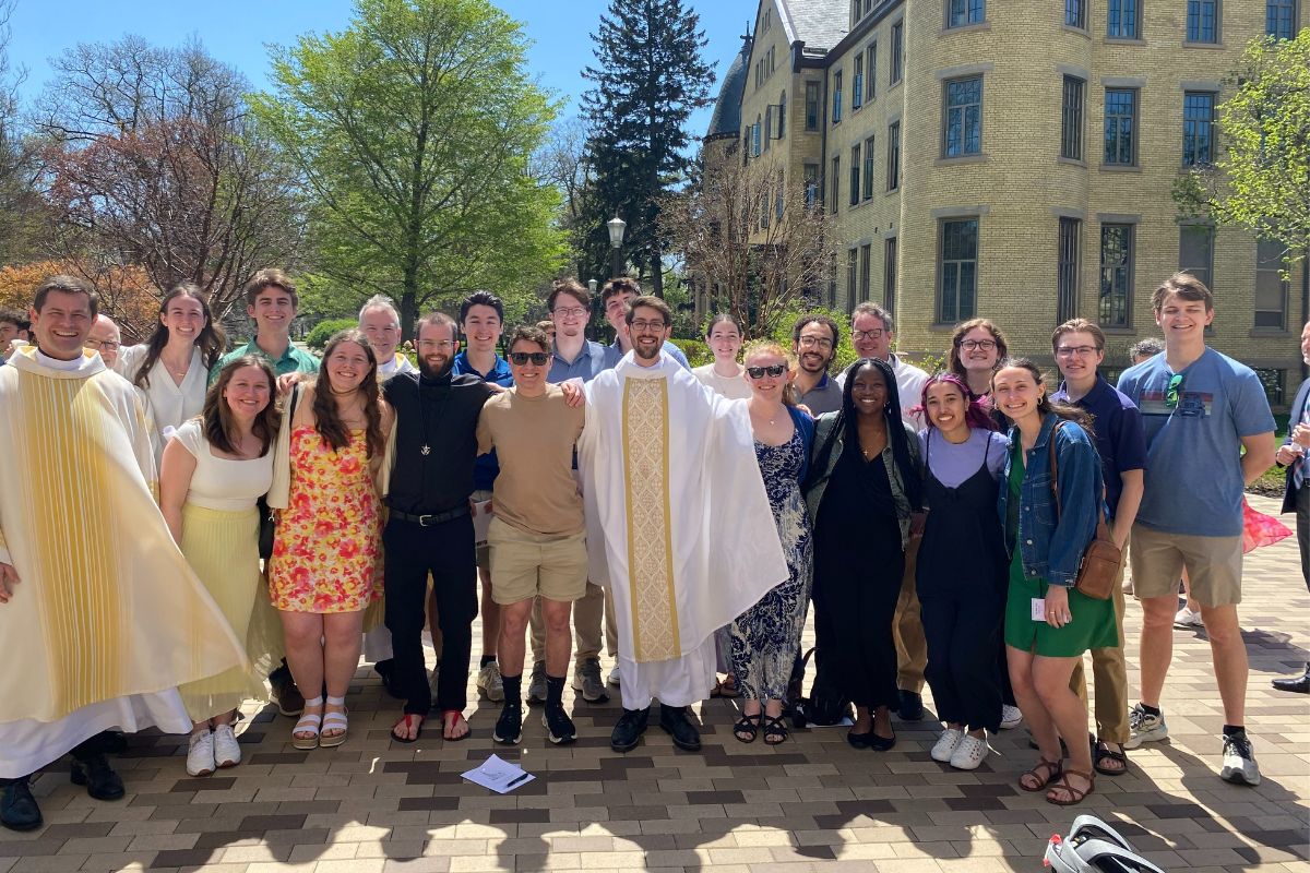 Students and staff from King's College gather with newly ordained Father Bevington