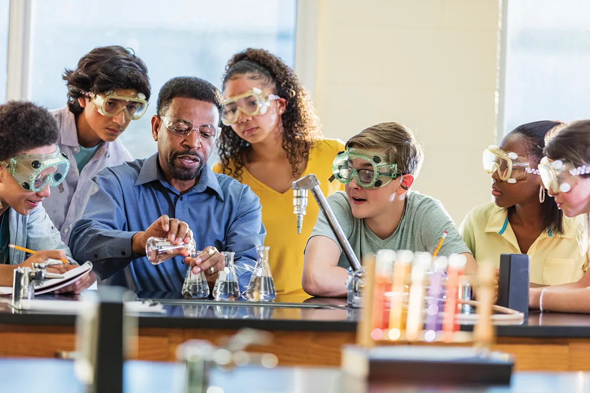STEM teacher with students stock image