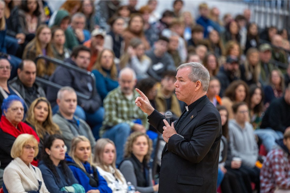 Father Looney addressing Fall 2024 Open House attendees