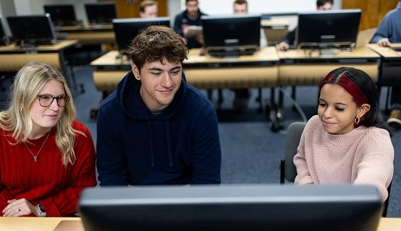 cis degree students using a computer in a lab