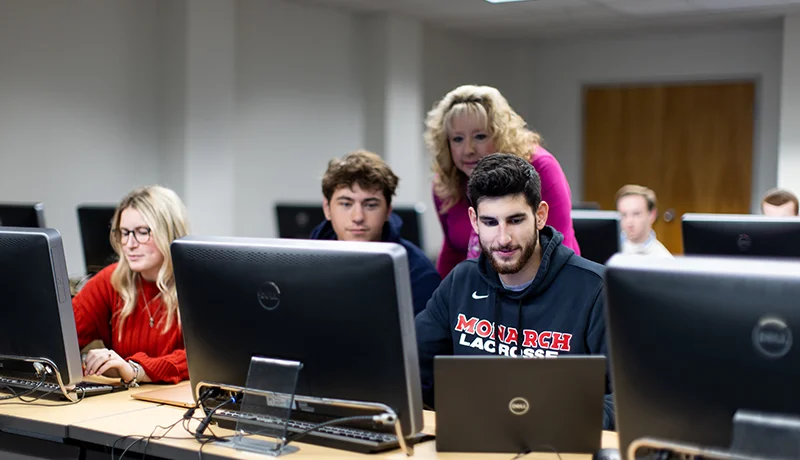what is computer science? students learn in a computer lab from a professor