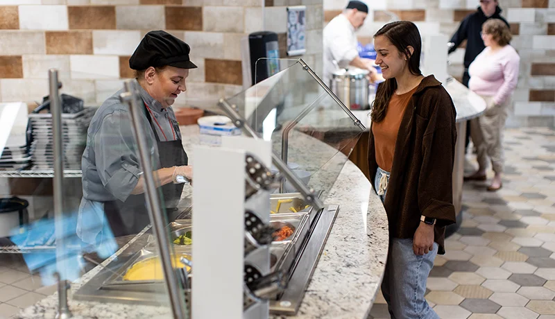 student being served food at king's court