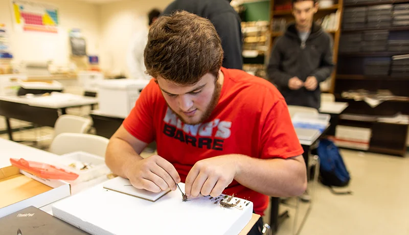 student studying out of a textbook