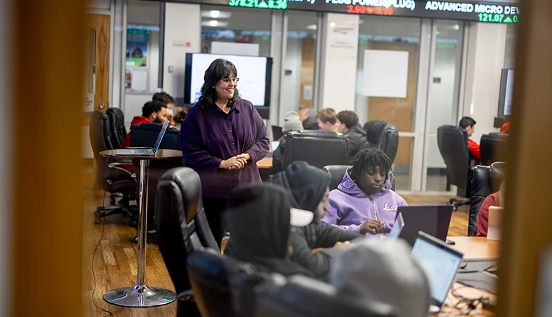 professor teaching students in a conference room