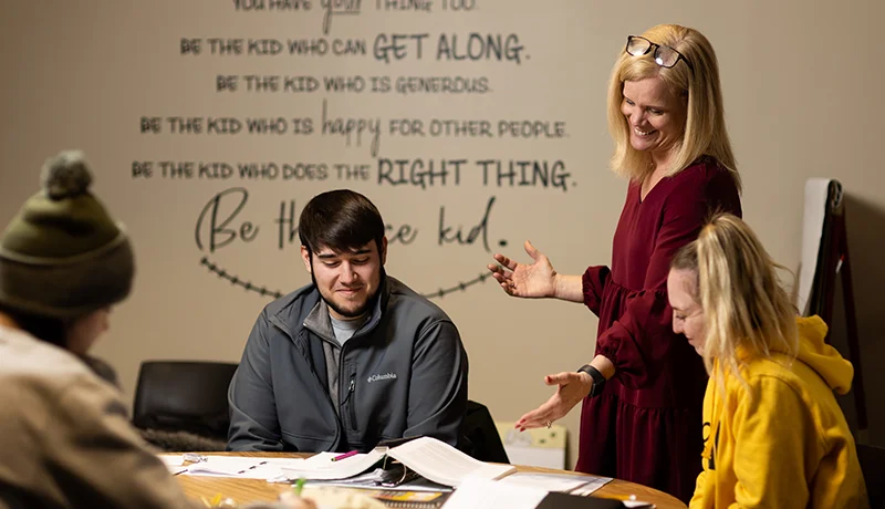 Professor teaching in a classroom setting