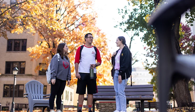 students standing outdoors talking