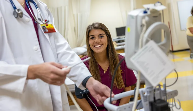 student reading a test result in a medical setting