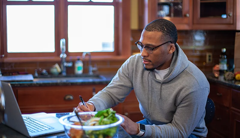 Graduate student studies in a kitchen setting