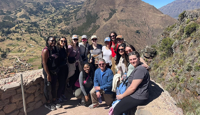 Students and faculty outdoors in the mountains of Greece