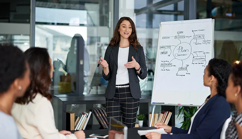 Woman presenting in an executive office