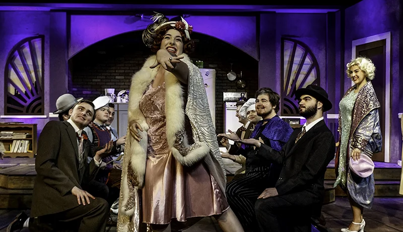 Theatre degree students acting on stage in costume