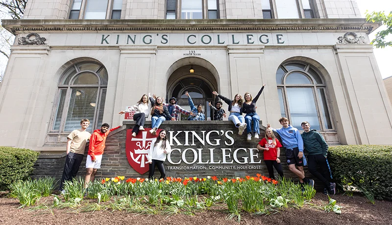 students cheering outside of admin building