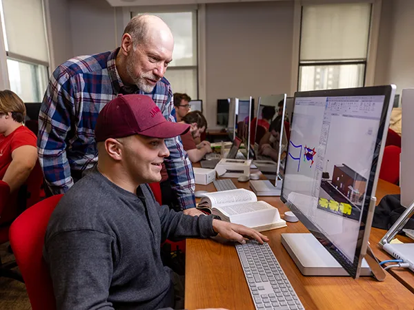 two people using a computer