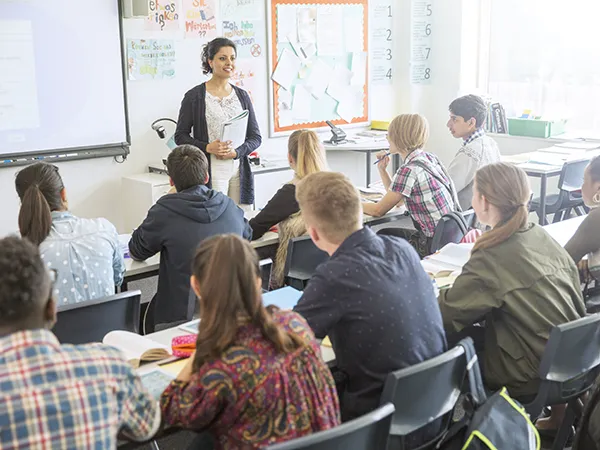 a professor teaching a class in an education classroom