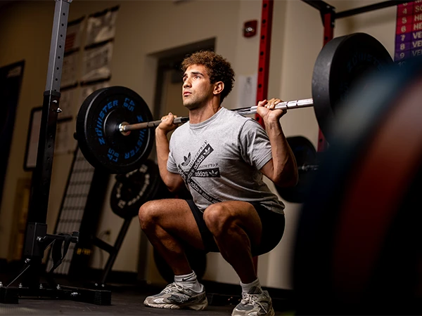 student weight training in the gym questioning what can I do with an exercise science degree