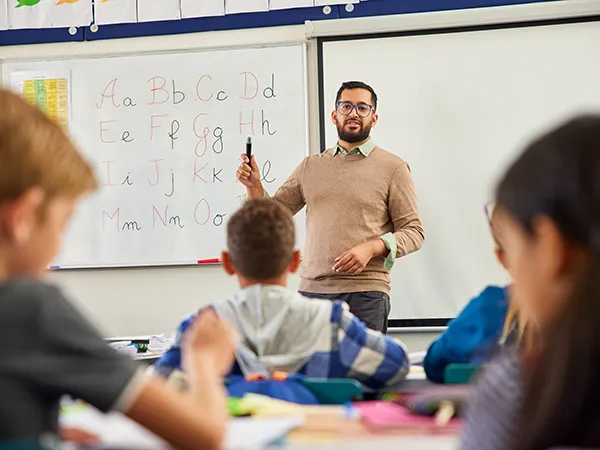 a professor teaching a class in an education classroom