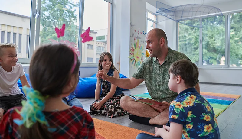 a teacher teaching a class in an special needs classroom