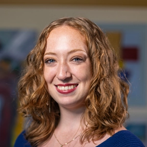 McKenna Dolan posing for a portrait in professional wear