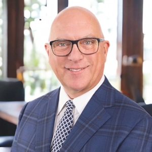 portrait photo of Mike in a suit and tie