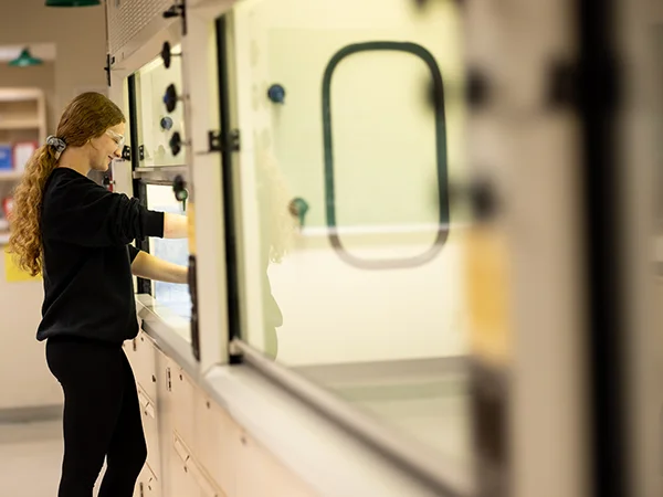 student using lab equipment