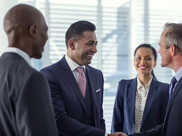 International Business Management degree holders shaking hands