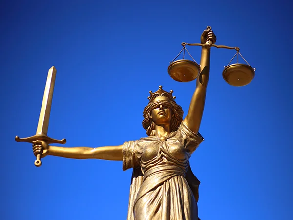 statue holding a balance scale and a sword, a symbol associated with a philosophy degree
