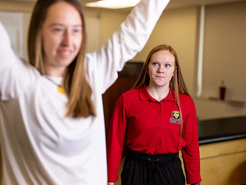 students practicing stretching techniques