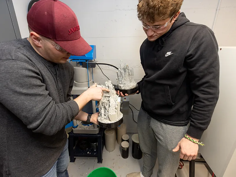 students looking at a 3D printed model