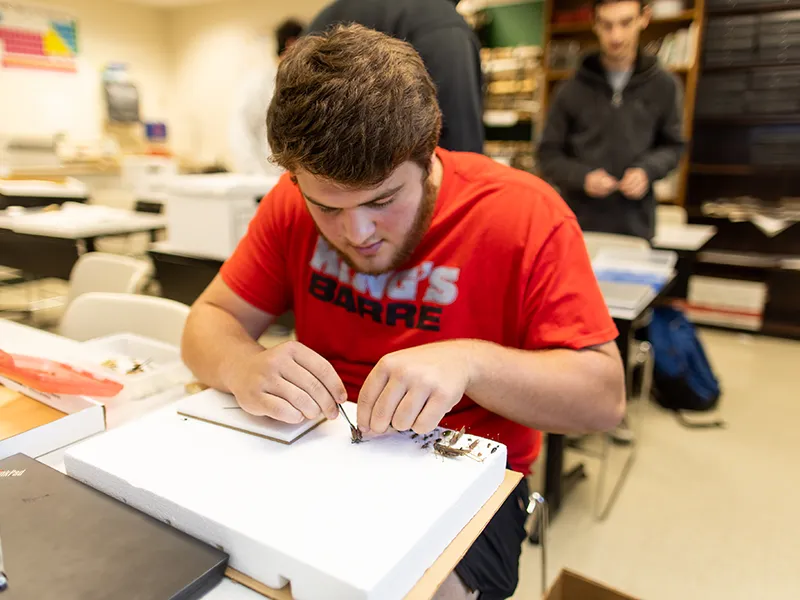 student studying from a textbook