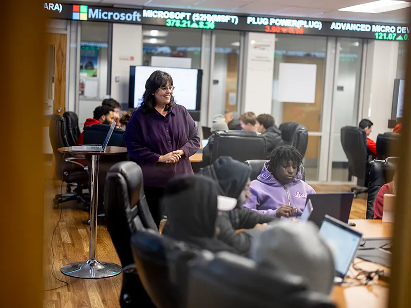 Students and a professor in the business building