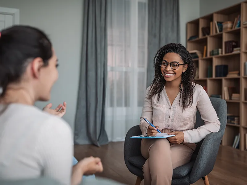 two people in a therapy session