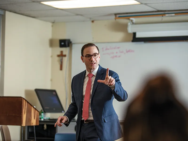 professor in a suit lecturing