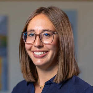 Portrait photo of Rachel Holena in professional attire.