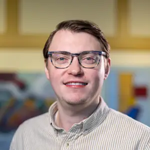 Portrait photo of Ryan in professional attire.