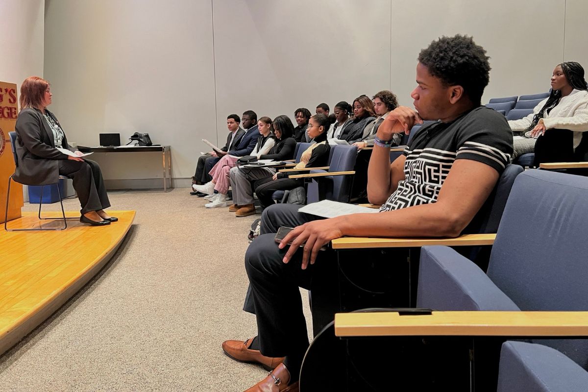 Students sitting, engaged by presenter. 