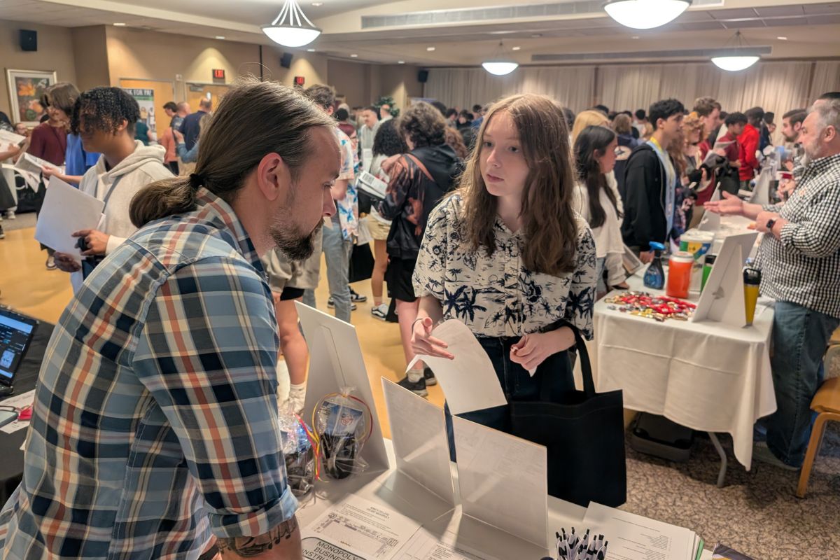 Student talking to Business Rep