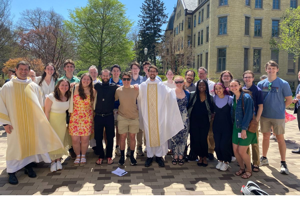 Students and staff from King's College gather with newly ordained Father Bevington