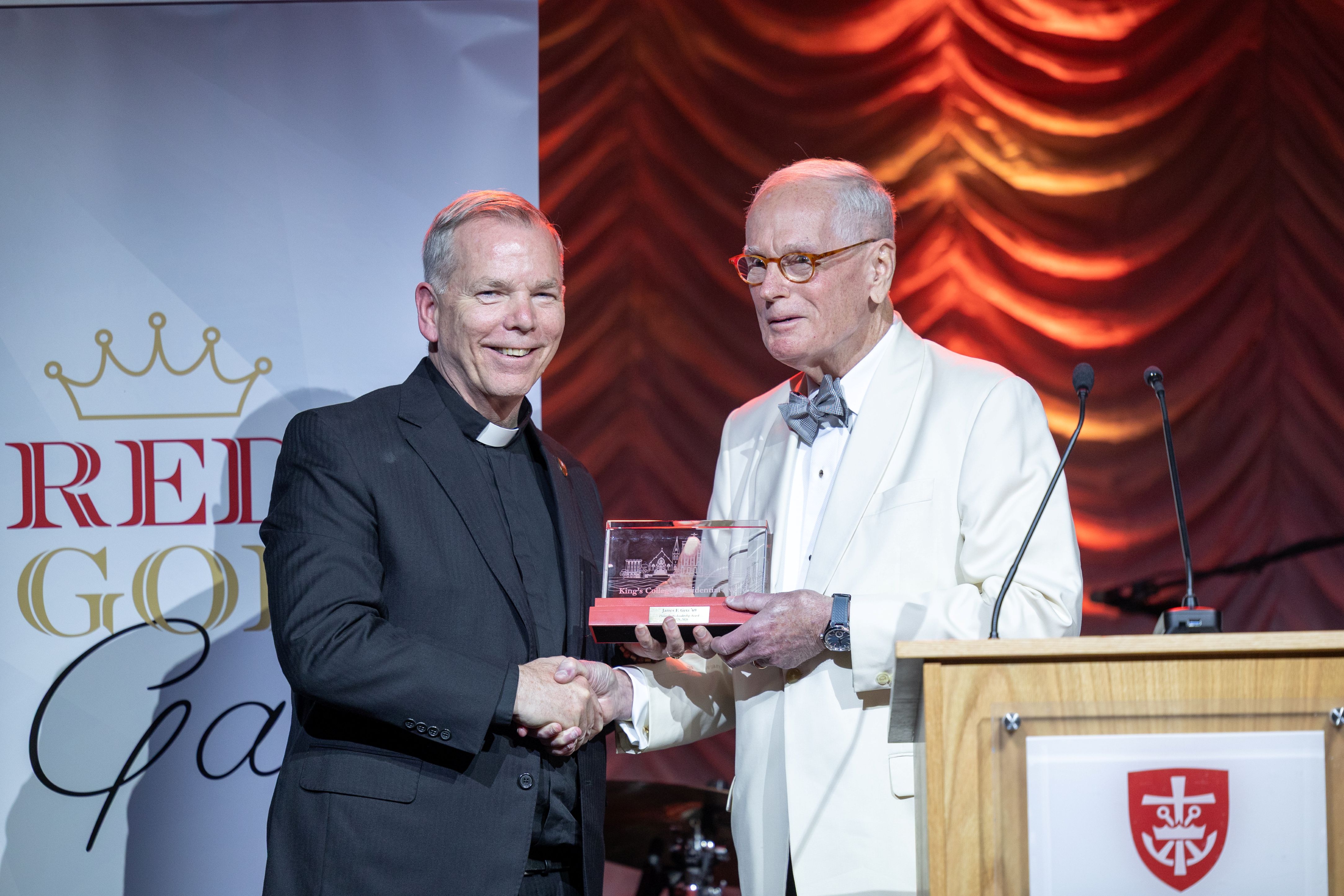 Rev. Thomas P. Looney, C.S.C., Ph.D. and James F. Getz ’69 pose for Philanthropy Award. 
