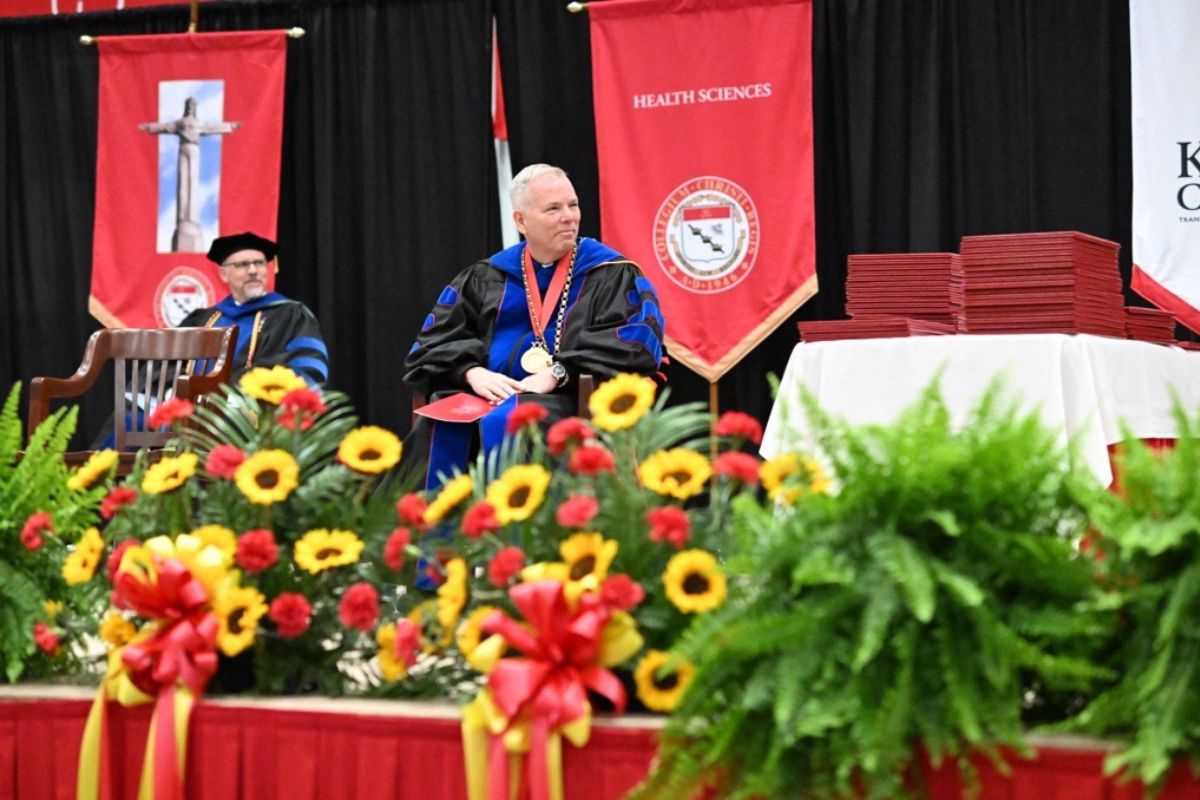 Father Looney On Stage At Commencement