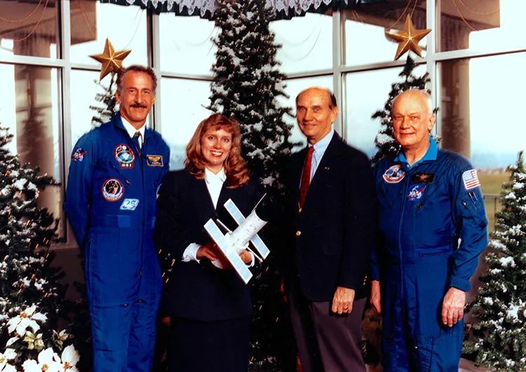 Astronaut Dr. Jeffery Hoffman, Ann Jenkins, Utah Senator Jake Garn, and Astronaut Bruce McCandless II at Hercules Aerospace in Utah in 1995