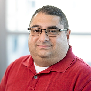 Portrait photo of Mark Carpentier in professional attire.