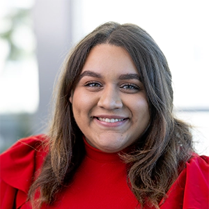 Portrait photo of Kelsey Cruz in professional attire.