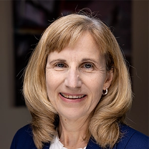 Portrait photo of Theresa in professional attire.