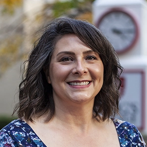 Portrait photo of Mary in professional attire.