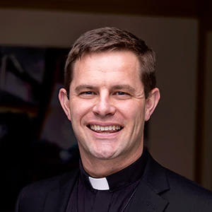 professional portrait photo of Fr. Brogan