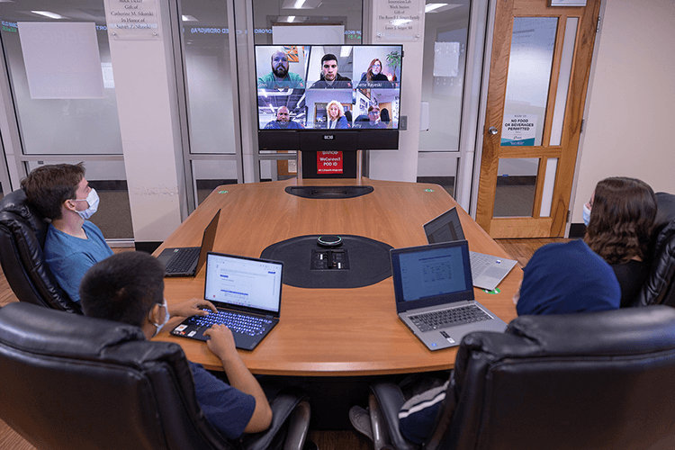 Students use webcast technology in the classroom.